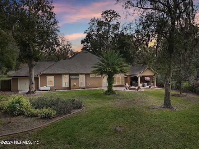 view of front of property with a yard