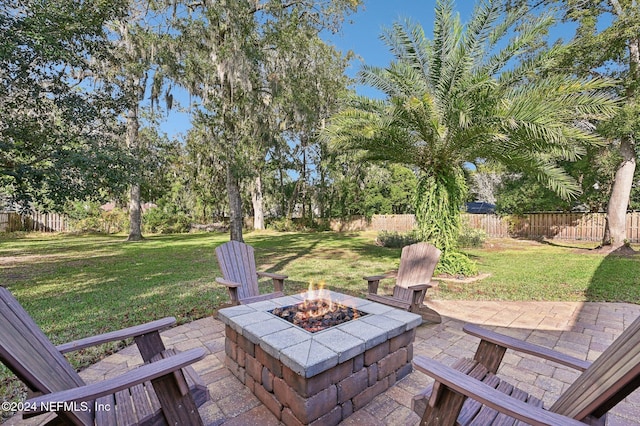 view of patio with a fire pit