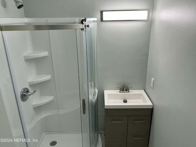 bathroom with vanity and an enclosed shower