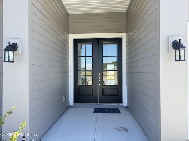 property entrance featuring french doors