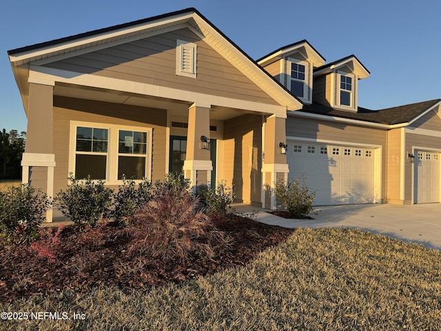 view of front of property featuring an attached garage and driveway