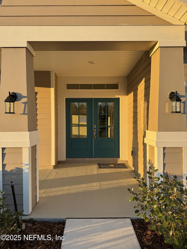 property entrance featuring french doors