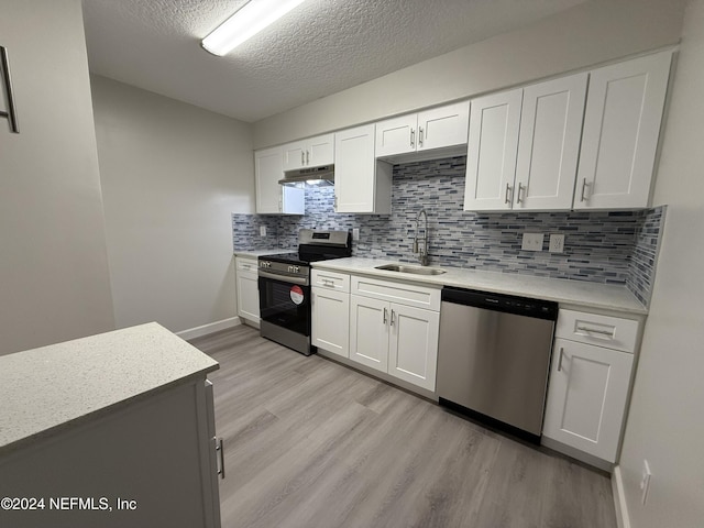 kitchen featuring white cabinets, stainless steel appliances, and sink