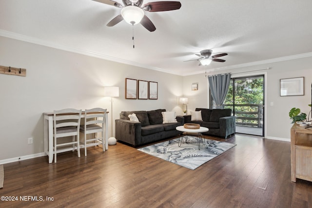 living room with ceiling fan, dark hardwood / wood-style flooring, and ornamental molding