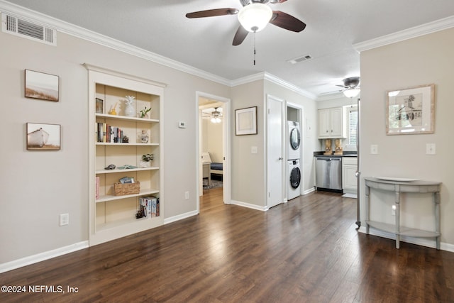 interior space featuring stacked washer / dryer, dark hardwood / wood-style flooring, a textured ceiling, and ornamental molding