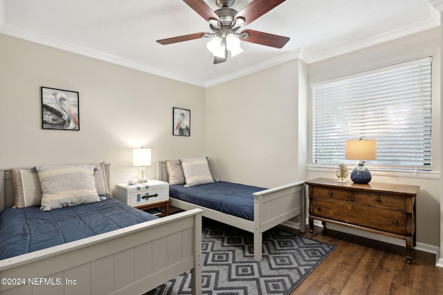 bedroom featuring ceiling fan, dark hardwood / wood-style floors, and ornamental molding