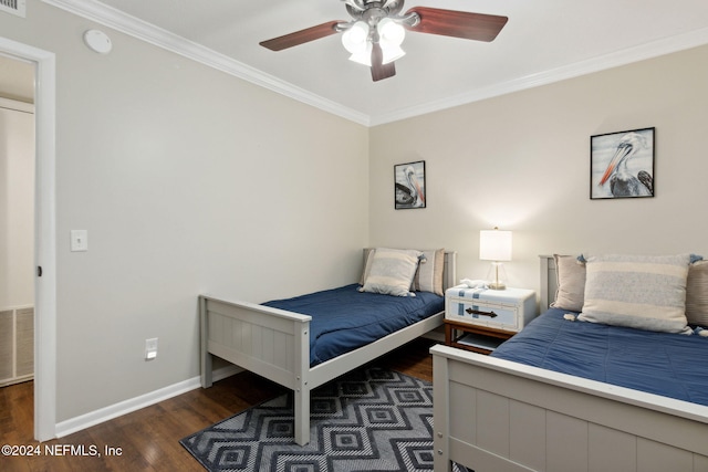 bedroom featuring ceiling fan, crown molding, and dark hardwood / wood-style floors