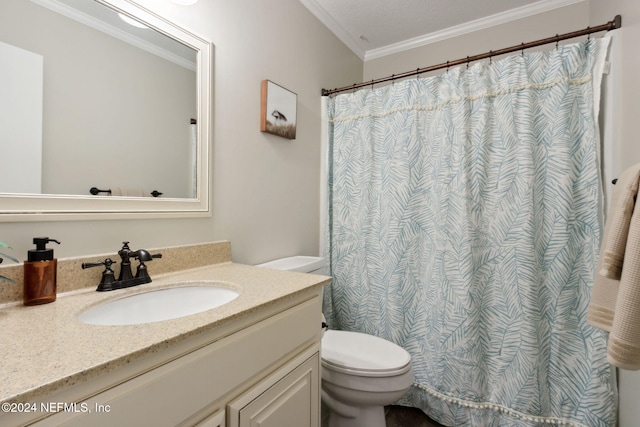 bathroom with vanity, toilet, and ornamental molding