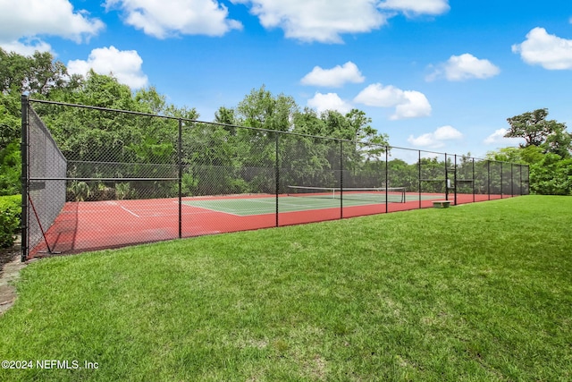 view of sport court featuring a yard