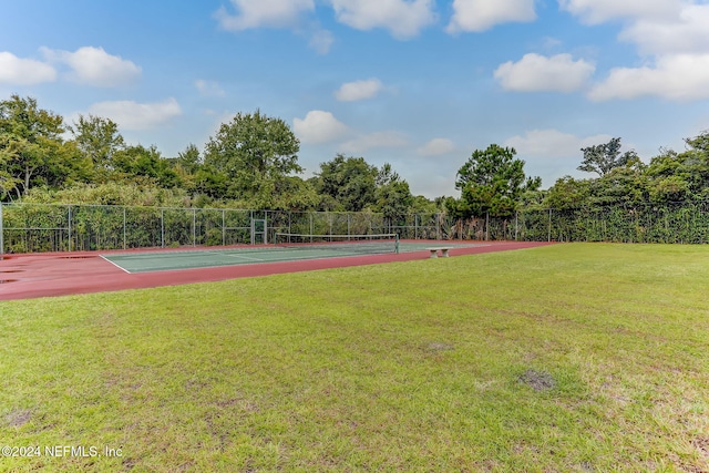 view of sport court featuring a yard