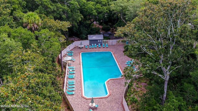 view of swimming pool featuring an outdoor structure