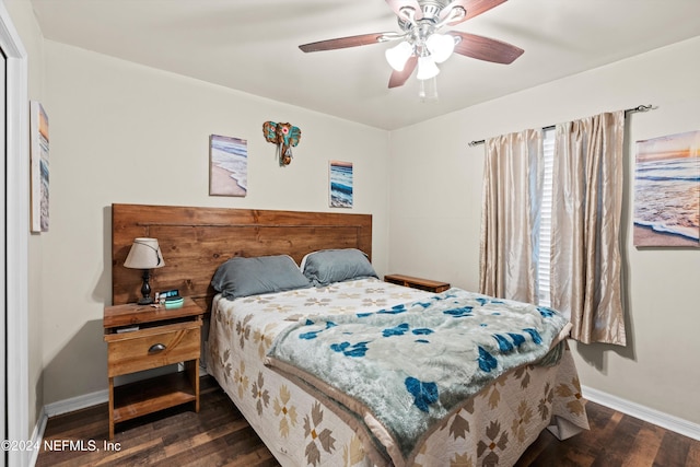 bedroom featuring ceiling fan and dark wood-type flooring