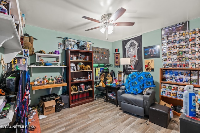 sitting room featuring ceiling fan and light hardwood / wood-style floors