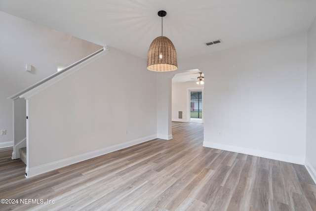 spare room with ceiling fan and light hardwood / wood-style flooring