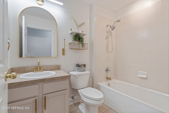 full bathroom with tile patterned floors, vanity, toilet, and tiled shower / bath