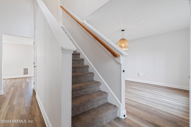 stairway featuring hardwood / wood-style floors