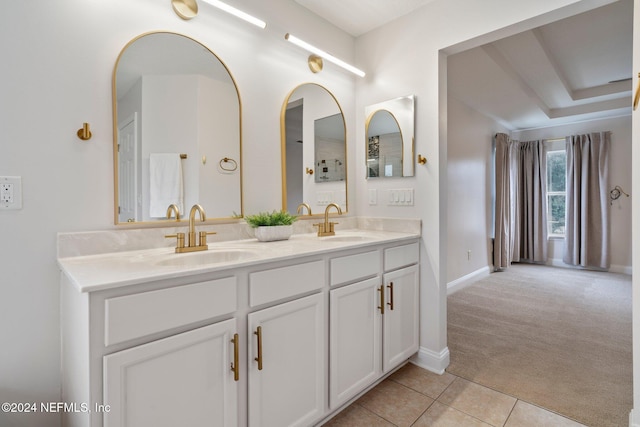 bathroom with tile patterned flooring and vanity