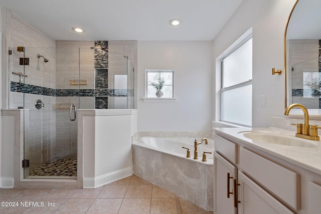 bathroom featuring tile patterned floors, vanity, and independent shower and bath