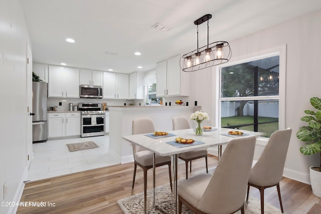 dining room with light hardwood / wood-style flooring