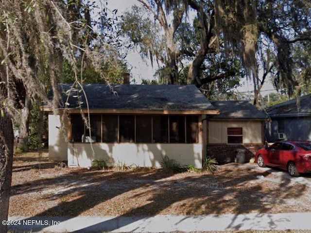 75 E 61st St, Jacksonville, FL 32208 - single story home featuring a sunroom and brick siding