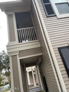 view of side of property featuring a balcony