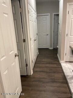 hallway featuring dark hardwood / wood-style floors