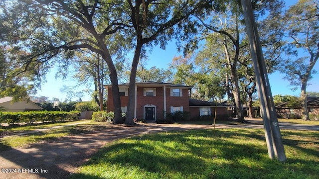 view of front of home with a front lawn