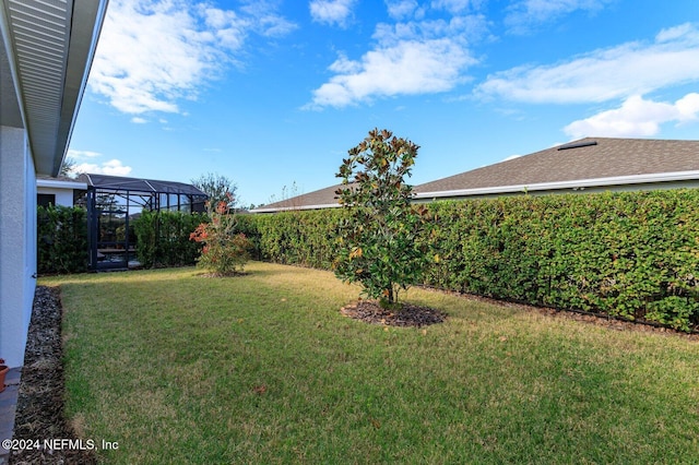 view of yard with a lanai