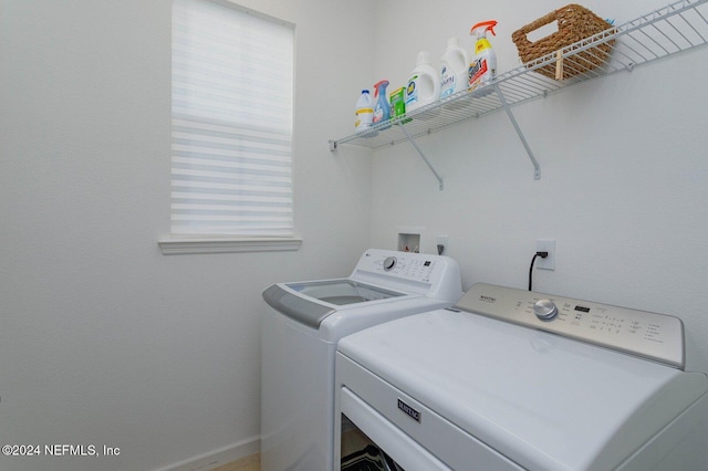 washroom with washing machine and dryer