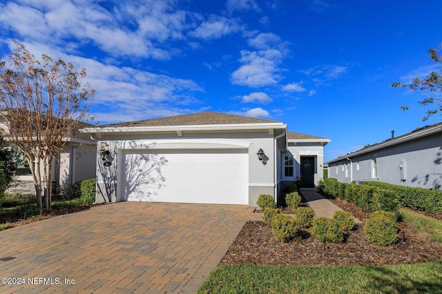 single story home with a garage