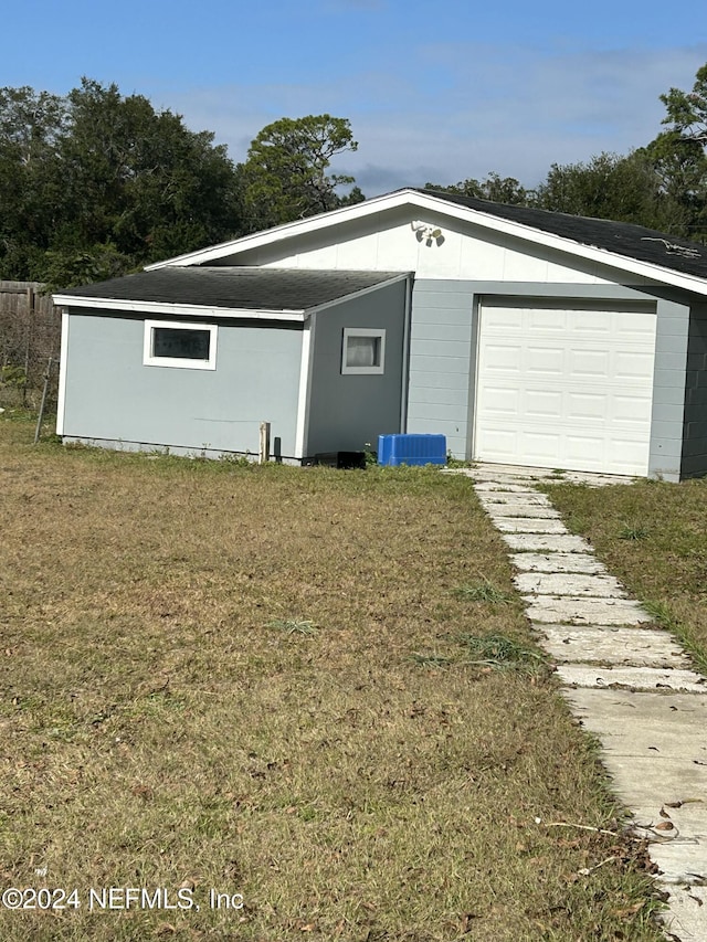 garage with a lawn