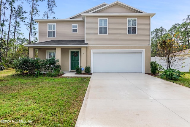 view of front facade featuring a garage and a front lawn