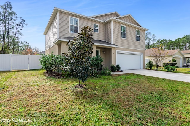 view of front of house featuring a front yard and a garage