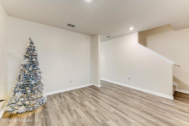 basement featuring light hardwood / wood-style flooring