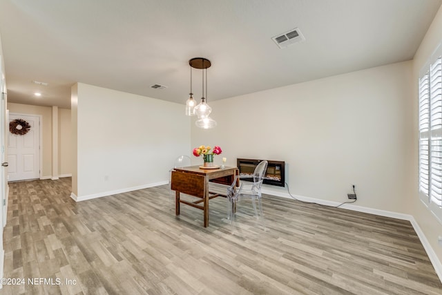 dining room with light hardwood / wood-style flooring