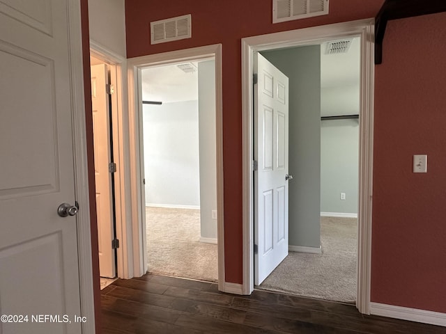 corridor featuring dark hardwood / wood-style flooring