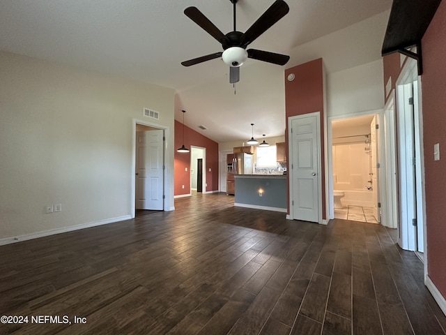 unfurnished living room featuring ceiling fan, dark wood-type flooring, and high vaulted ceiling