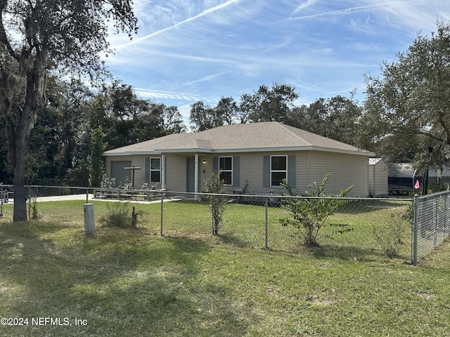 ranch-style home featuring a front lawn