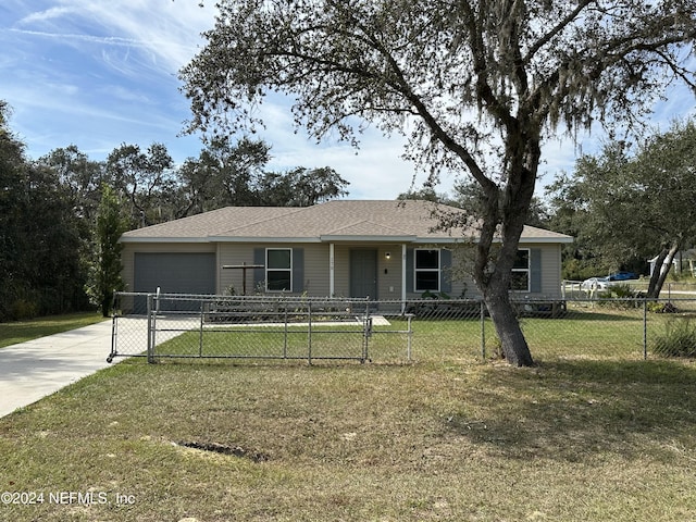 ranch-style house with a front yard and a garage