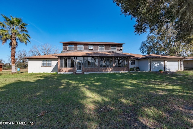 view of front facade featuring a front lawn and a garage