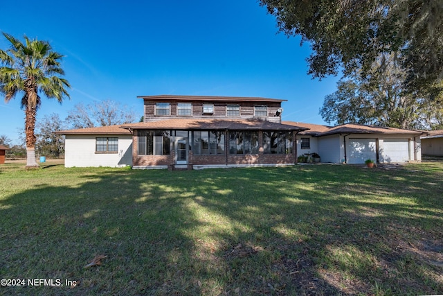 11289 SW 85th Ave, Hampton, FL 32044 - rear view of house with a yard and a garage