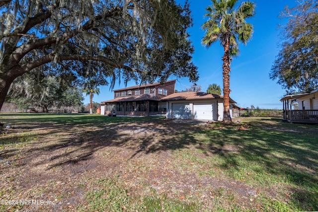 rear view of house with a lawn