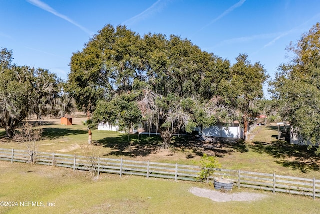 view of yard with a rural view