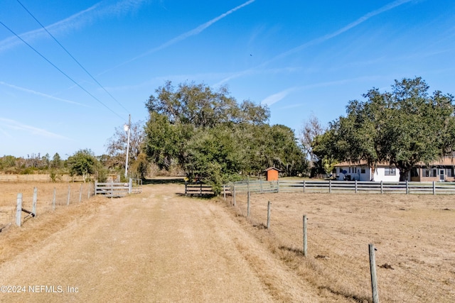 view of yard with a rural view