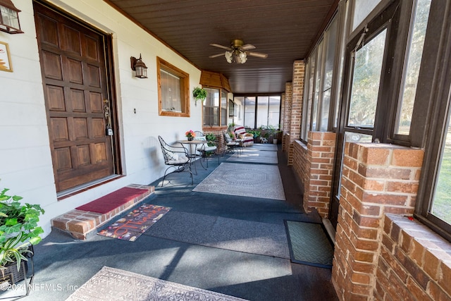 unfurnished sunroom featuring plenty of natural light and ceiling fan