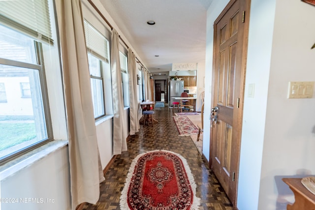 hallway featuring dark parquet floors