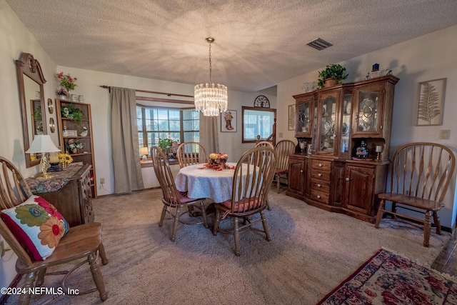 11289 SW 85th Ave, Hampton, FL 32044 - dining room featuring a chandelier, a textured ceiling, and light colored carpet