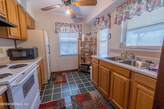 kitchen featuring white electric range oven, ventilation hood, ceiling fan, sink, and dark tile patterned flooring