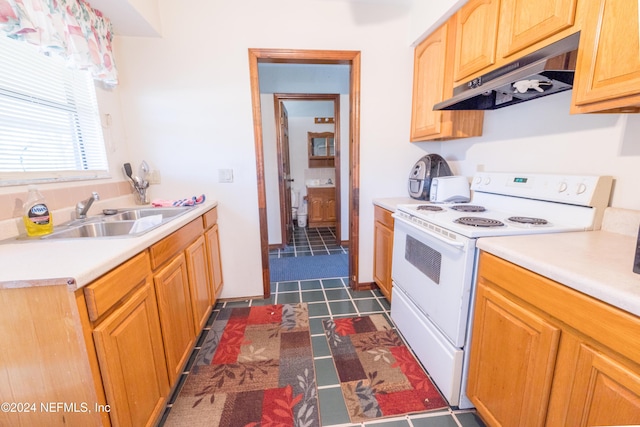 11289 SW 85th Ave, Hampton, FL 32044 - kitchen featuring white electric stove, under cabinet range hood, light countertops, and dark tile patterned flooring