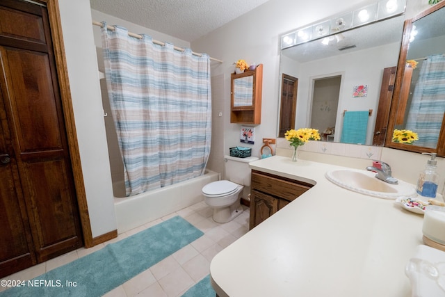 full bathroom with shower / bath combo, tile patterned floors, a textured ceiling, vanity, and toilet